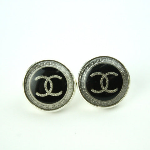 Silver and black stud earrings with authentic chanel button